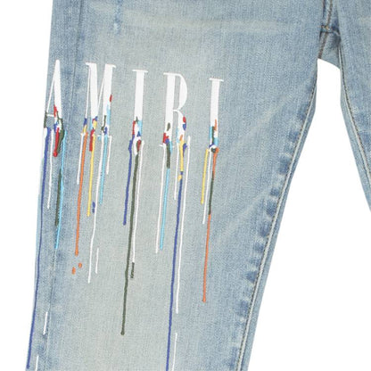 AMIRI PAINT DRIP CORE LOGO SKINNY JEANS